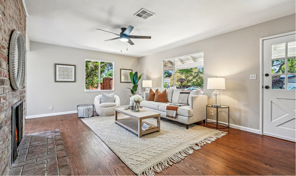 Living room after decluttering, refinishing floor, and painting.
