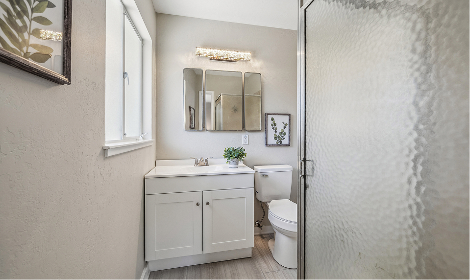 Bathroom after changing cabinets, toilets and fresh painting